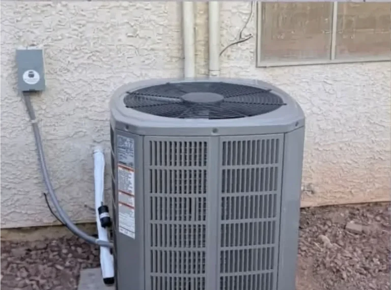AC condenser on a gravel pad outside a Las Vegas home